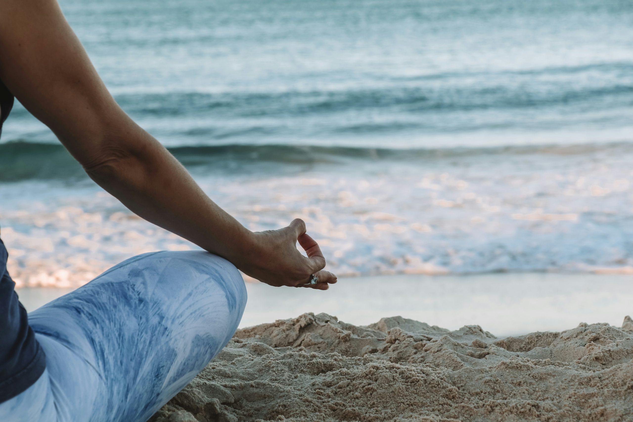 Lady meditating in nature, practicing mindfulness for wellbeing and perimenopause relief. Surrounded by calm natural surroundings, she embodies peace and balance, focusing on inner health, stress reduction, and holistic wellness during perimenopause.