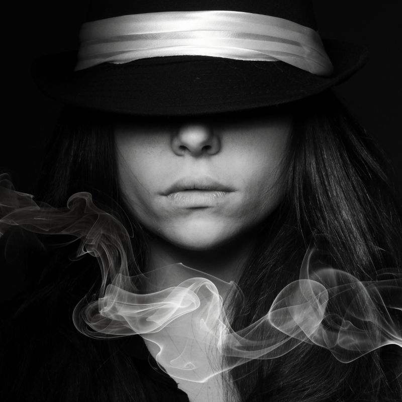 Phantom smells during menopause with a woman covering her eyes and smoke streaming across under her nose.