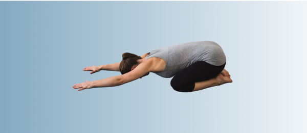 Woman in Child’s Pose practicing gentle yoga for perimenopause relief