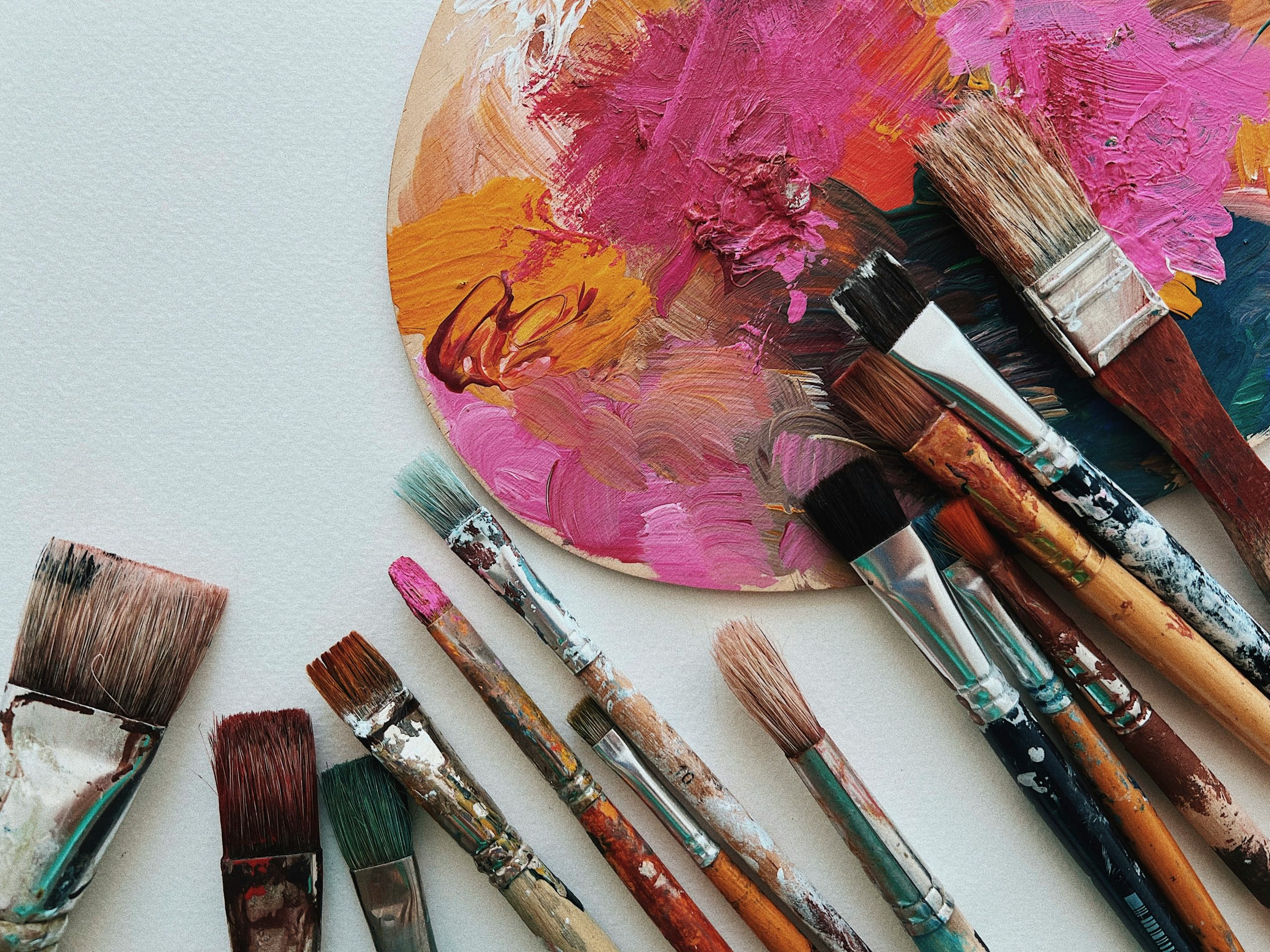 Creative self-care for perimenopause wellbeing – paint brushes on a table symbolize mindfulness, expression, and stress relief for women navigating hormonal changes.