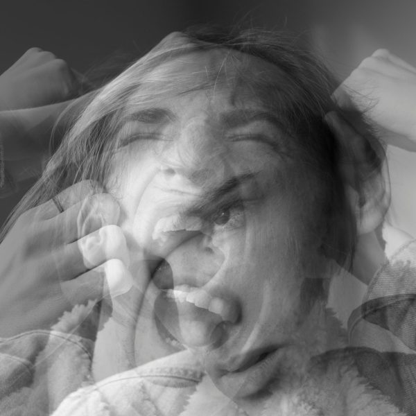 “Woman laughing and then frustrated, representing menopause mood swings”
